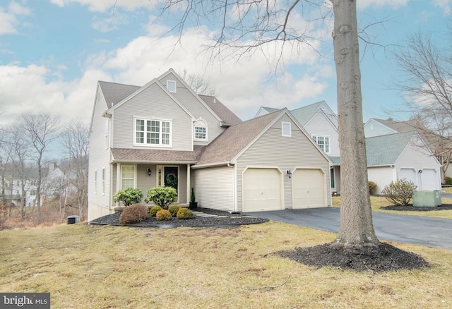 front of property featuring a garage and a front lawn