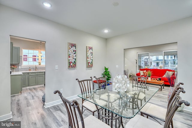 dining space with light wood-type flooring