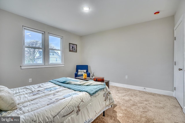 bedroom with light colored carpet