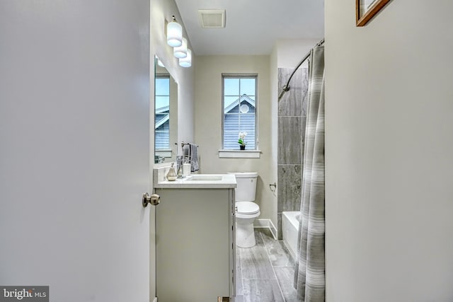 full bathroom with vanity, toilet, and shower / bathtub combination with curtain