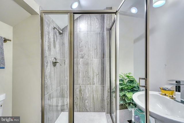 bathroom featuring lofted ceiling and an enclosed shower