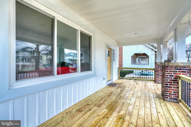 wooden deck featuring covered porch