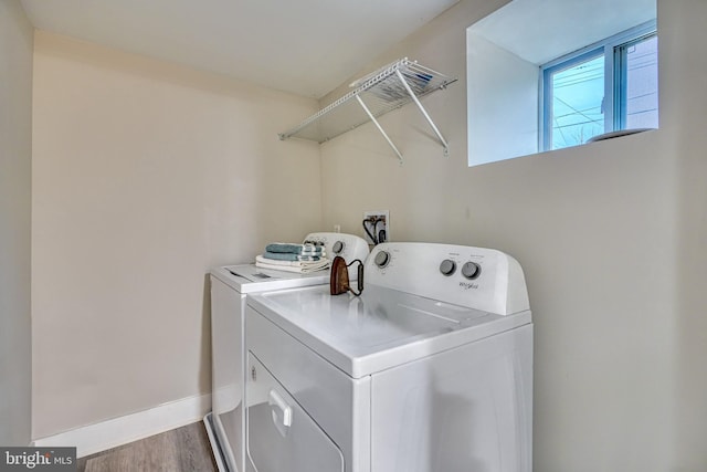 laundry room featuring hardwood / wood-style floors and independent washer and dryer