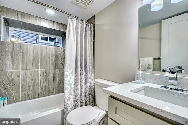 full bathroom with vanity, toilet, and shower / bath combo with shower curtain