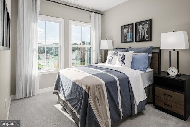 bedroom with light colored carpet