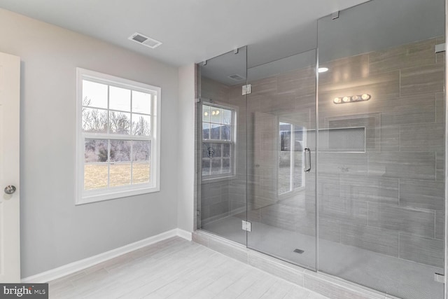 bathroom with a shower with shower door