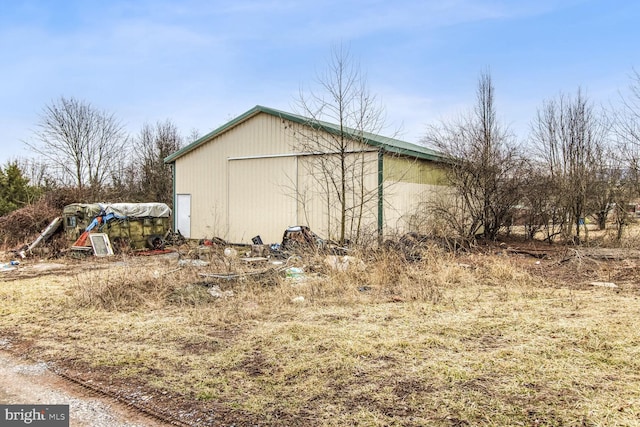 view of side of property with an outbuilding