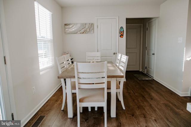 dining area featuring dark hardwood / wood-style floors