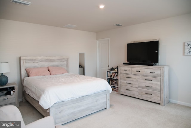 bedroom with light carpet