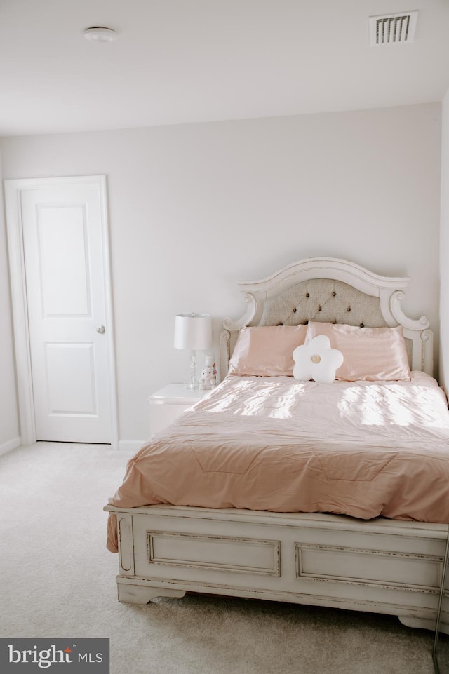 unfurnished bedroom with light colored carpet