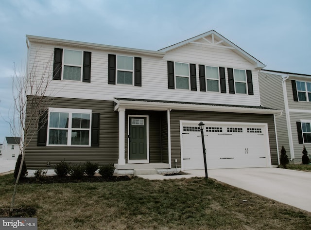 view of front facade with a garage and a front lawn