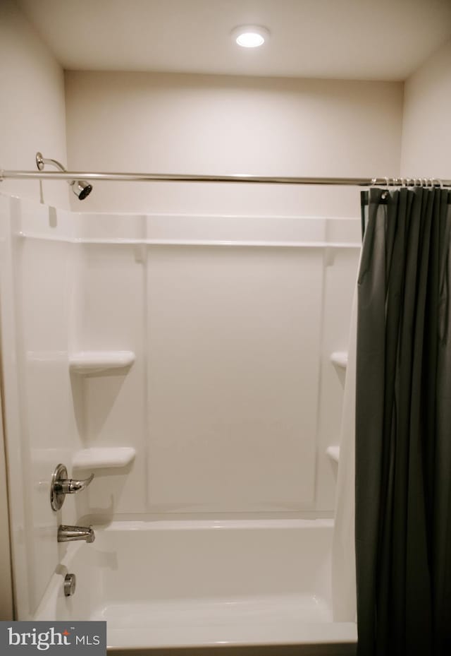 bathroom featuring shower / bath combination with curtain