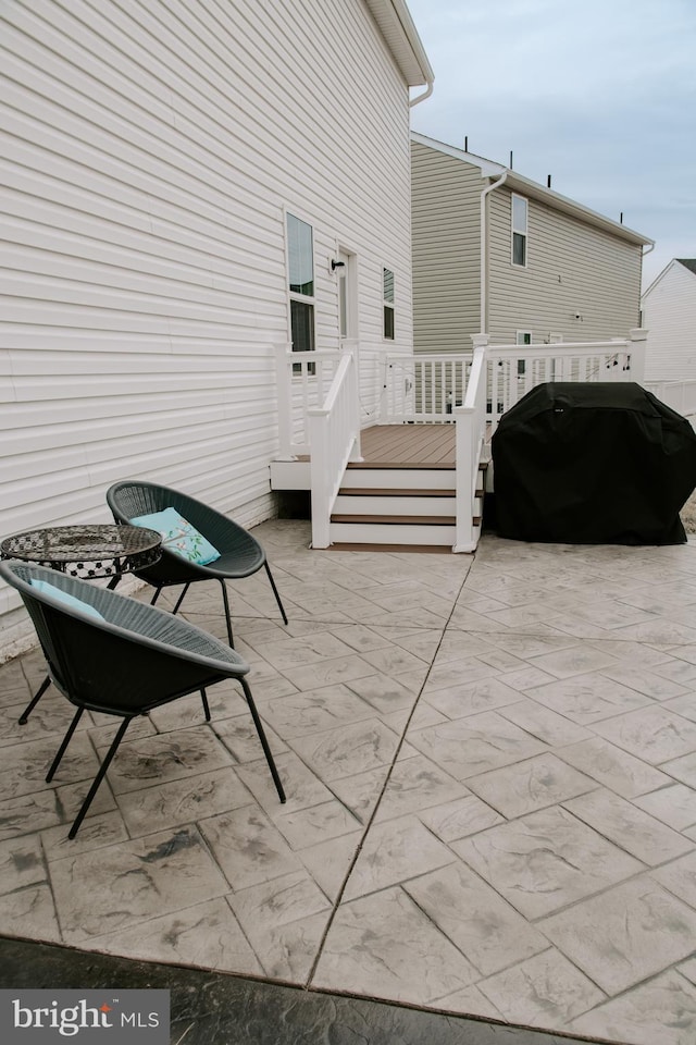 view of patio / terrace with a grill and a deck