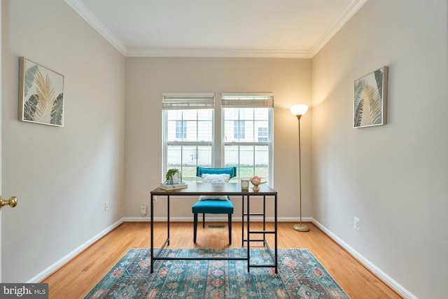 office space with baseboards, wood finished floors, and crown molding