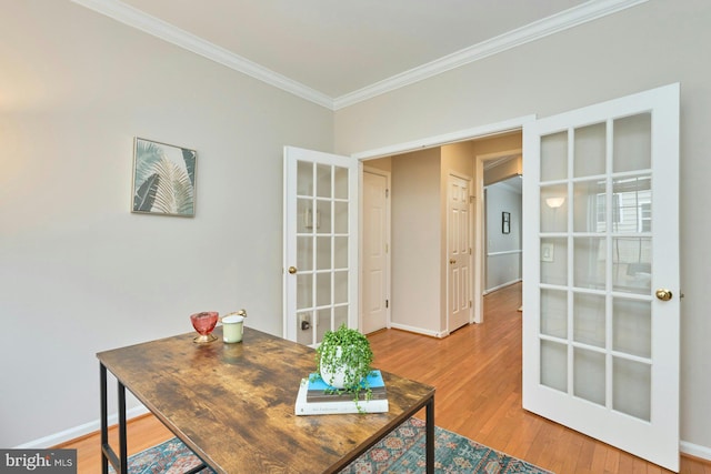 office area with wood finished floors, crown molding, french doors, and baseboards