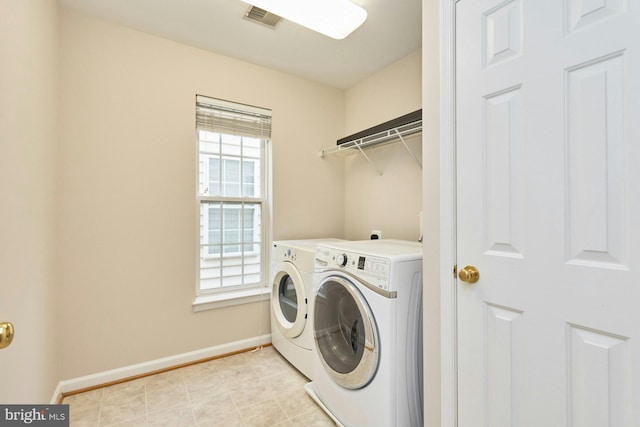 laundry room with washer and dryer, laundry area, baseboards, and visible vents