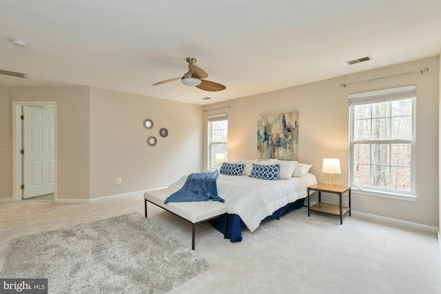 bedroom featuring visible vents, baseboards, carpet, and ceiling fan