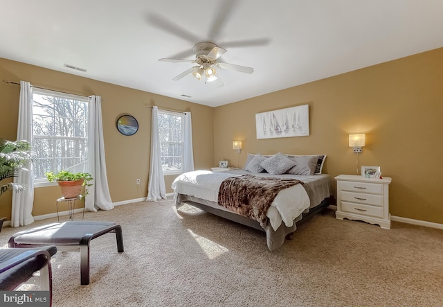 bedroom with light carpet and ceiling fan