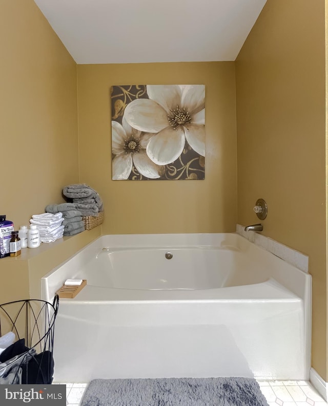 bathroom featuring a bathing tub and tile patterned flooring