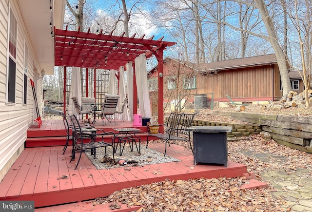 wooden terrace with a pergola