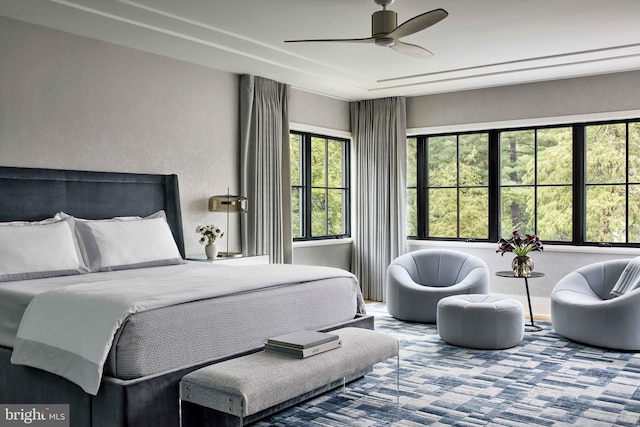 bedroom featuring ceiling fan and carpet flooring