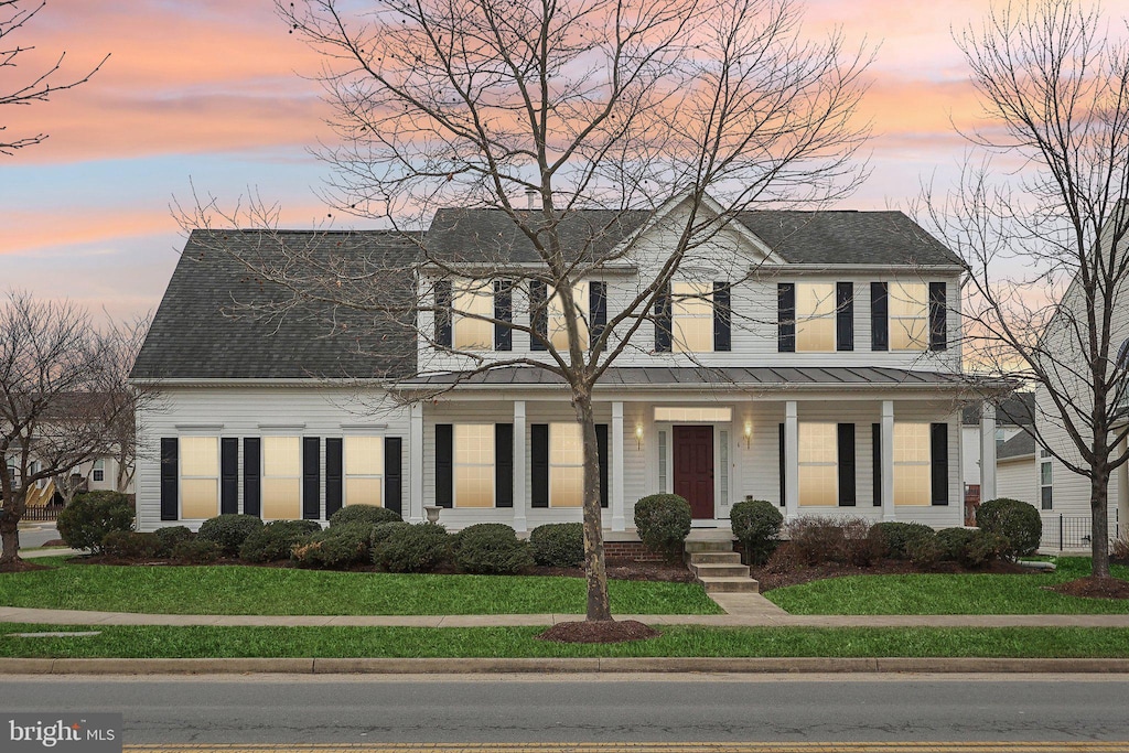 view of front of house with a yard