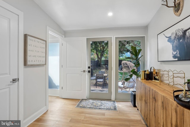 doorway with light hardwood / wood-style floors