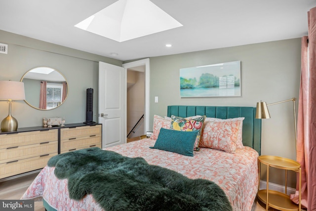 bedroom featuring a skylight