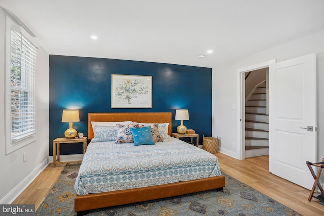 bedroom with hardwood / wood-style floors