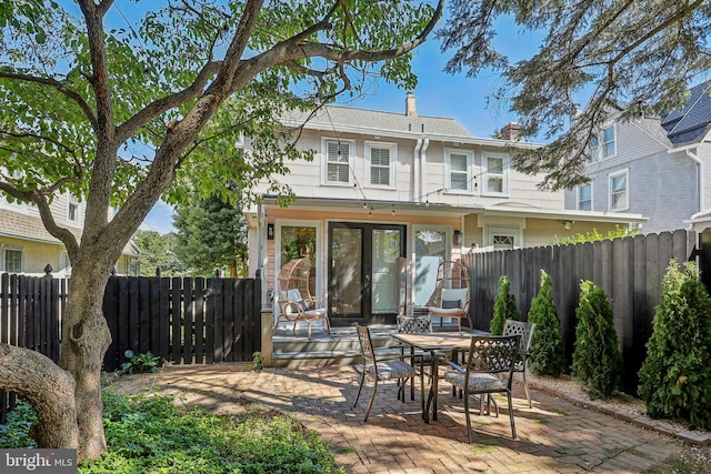 rear view of house featuring a patio