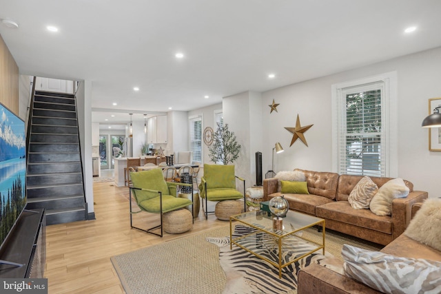 living room with light hardwood / wood-style flooring and a wealth of natural light