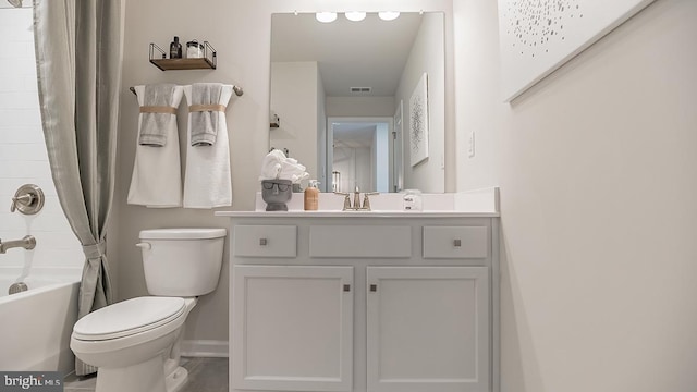 full bathroom with shower / bath combo, vanity, and toilet