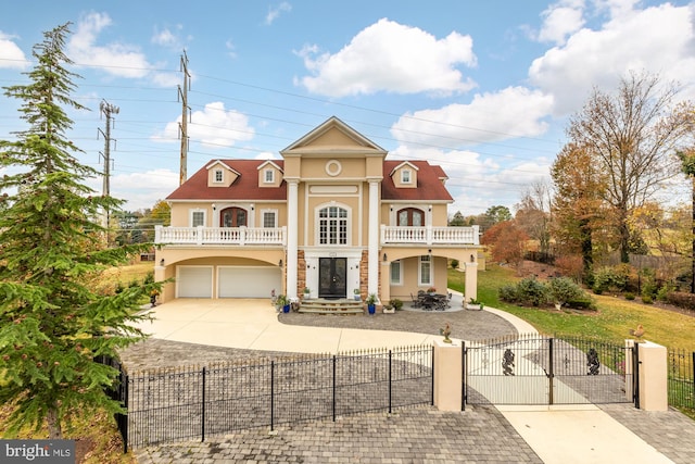 view of front of property with a garage and a balcony