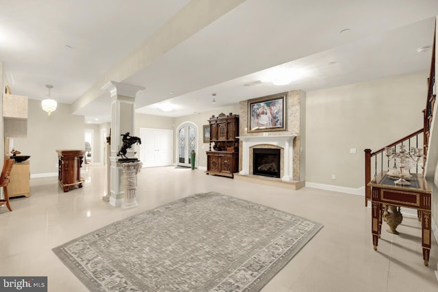 living room with decorative columns