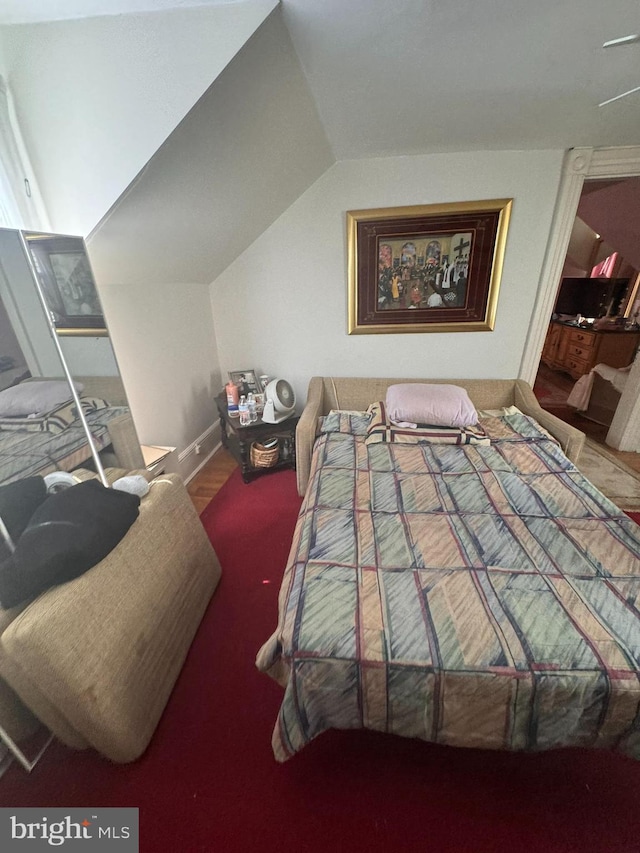 bedroom featuring vaulted ceiling