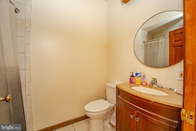 bathroom featuring tile patterned flooring, vanity, walk in shower, and toilet