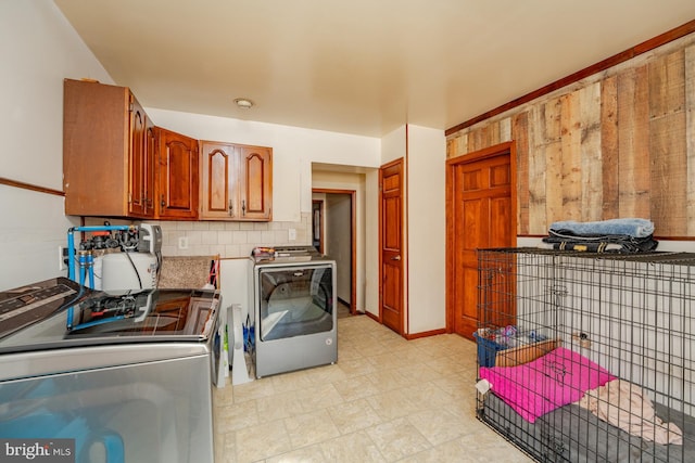 kitchen featuring separate washer and dryer and decorative backsplash