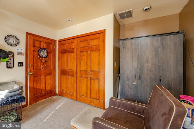 entryway with light colored carpet