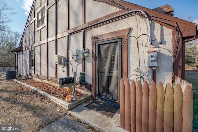 doorway to property featuring cooling unit