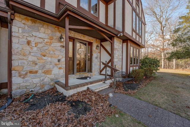 property entrance with a yard