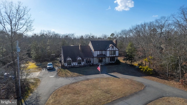 tudor house featuring a front yard