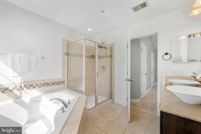 bathroom with tile patterned floors, visible vents, a stall shower, and a bath