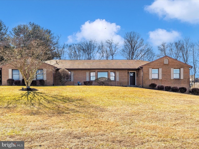 ranch-style house featuring a front lawn