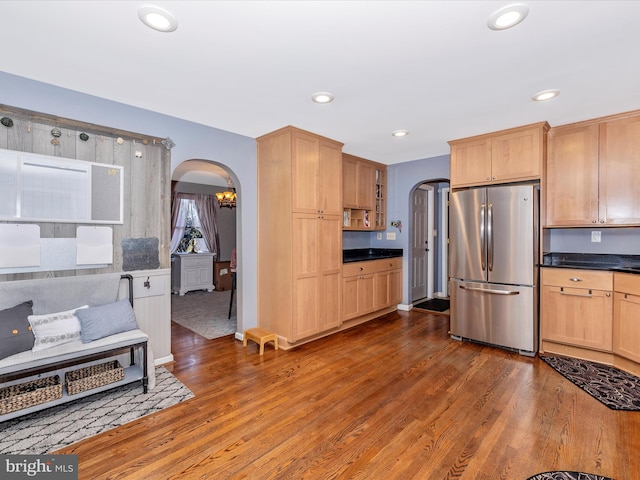 kitchen featuring dark hardwood / wood-style floors and stainless steel refrigerator