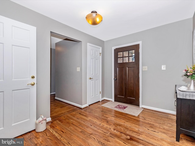 entryway with hardwood / wood-style flooring