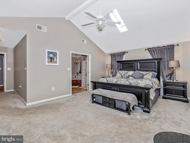 carpeted bedroom featuring connected bathroom, high vaulted ceiling, a skylight, ceiling fan, and beam ceiling