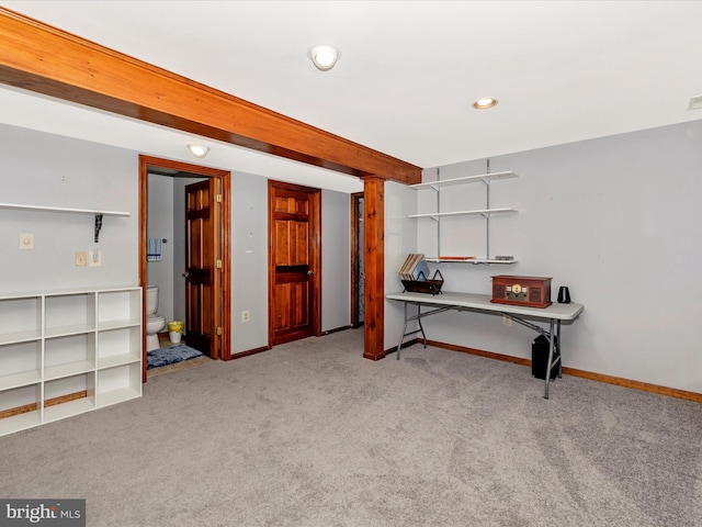 basement featuring light colored carpet