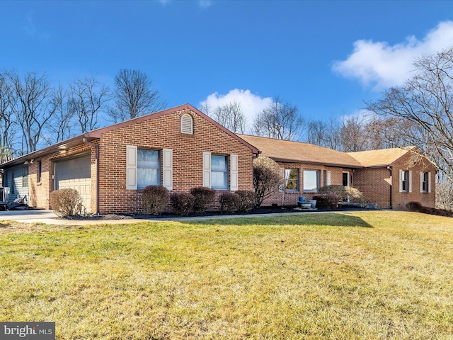 single story home featuring a garage and a front lawn