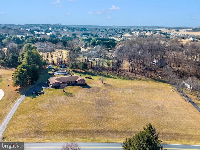 birds eye view of property with a rural view