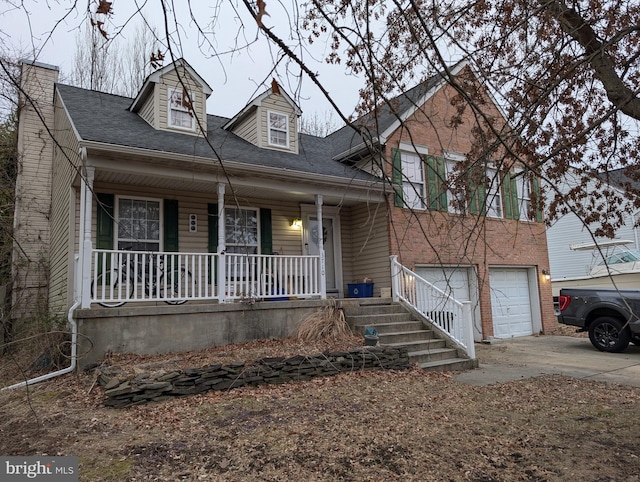 view of front facade with a garage and a porch